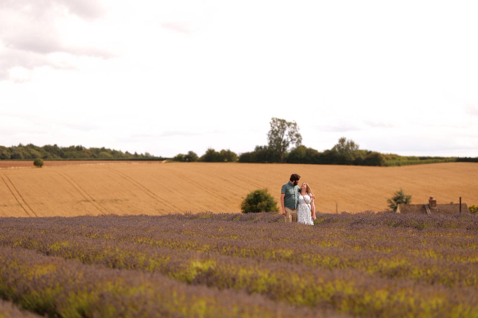 The two of us in a lavender field, surrounded by golden countryside.